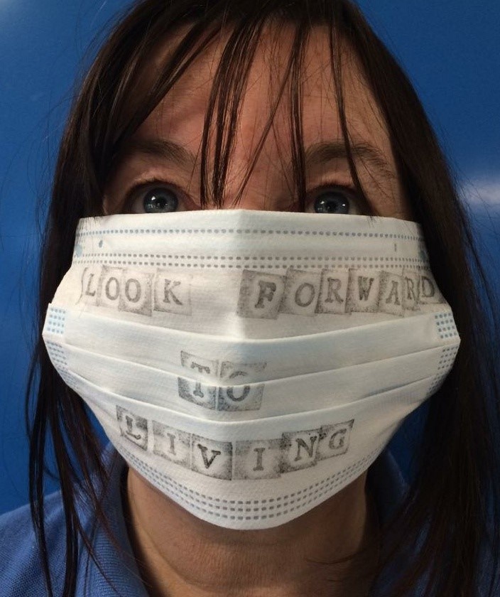 Ysbytyr Seren staff workshop lady with face mask on her with text drawn on saying look forward to living